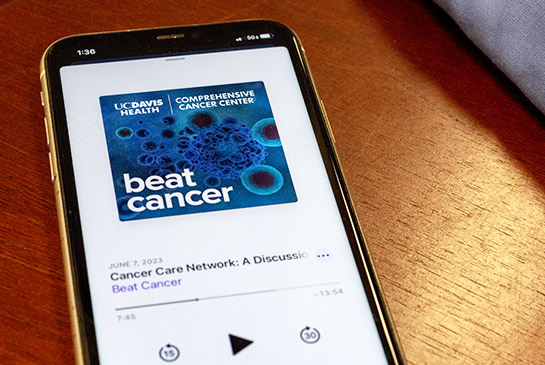 The Beat Cancer Podcast shown on a phone.